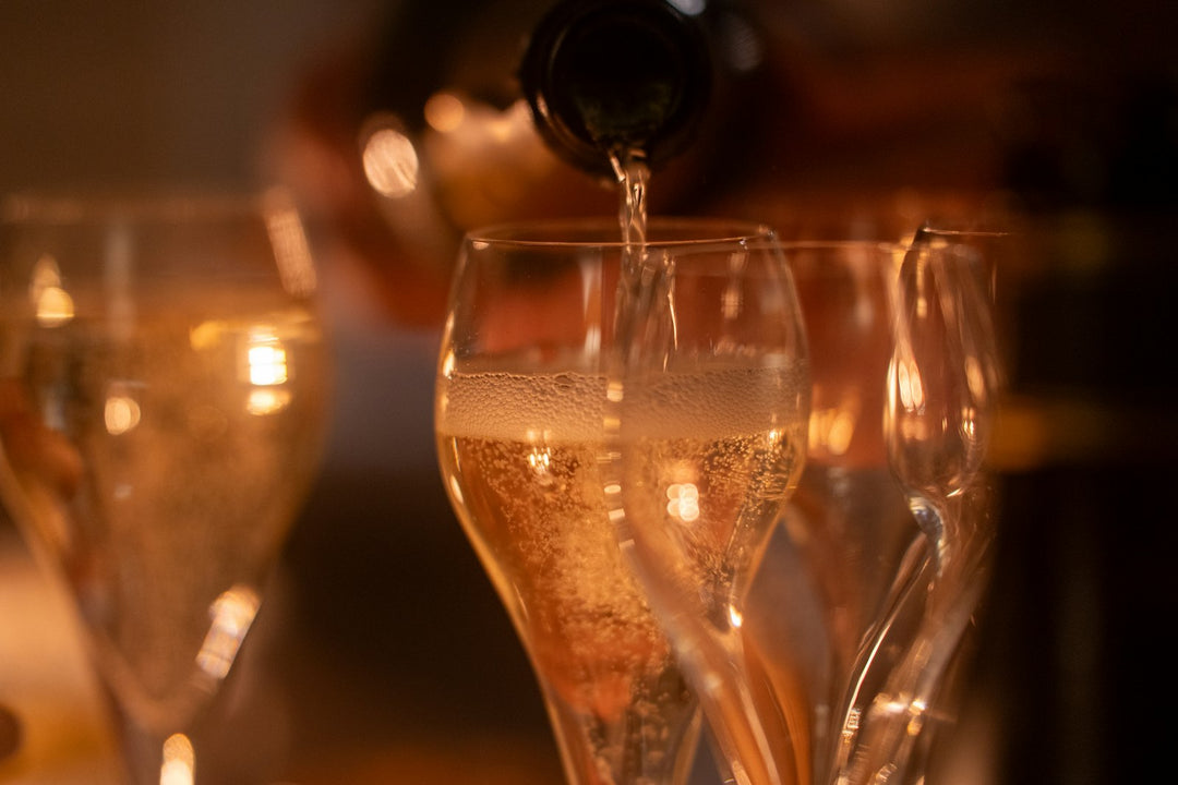 Champagne pour with bokeh lights